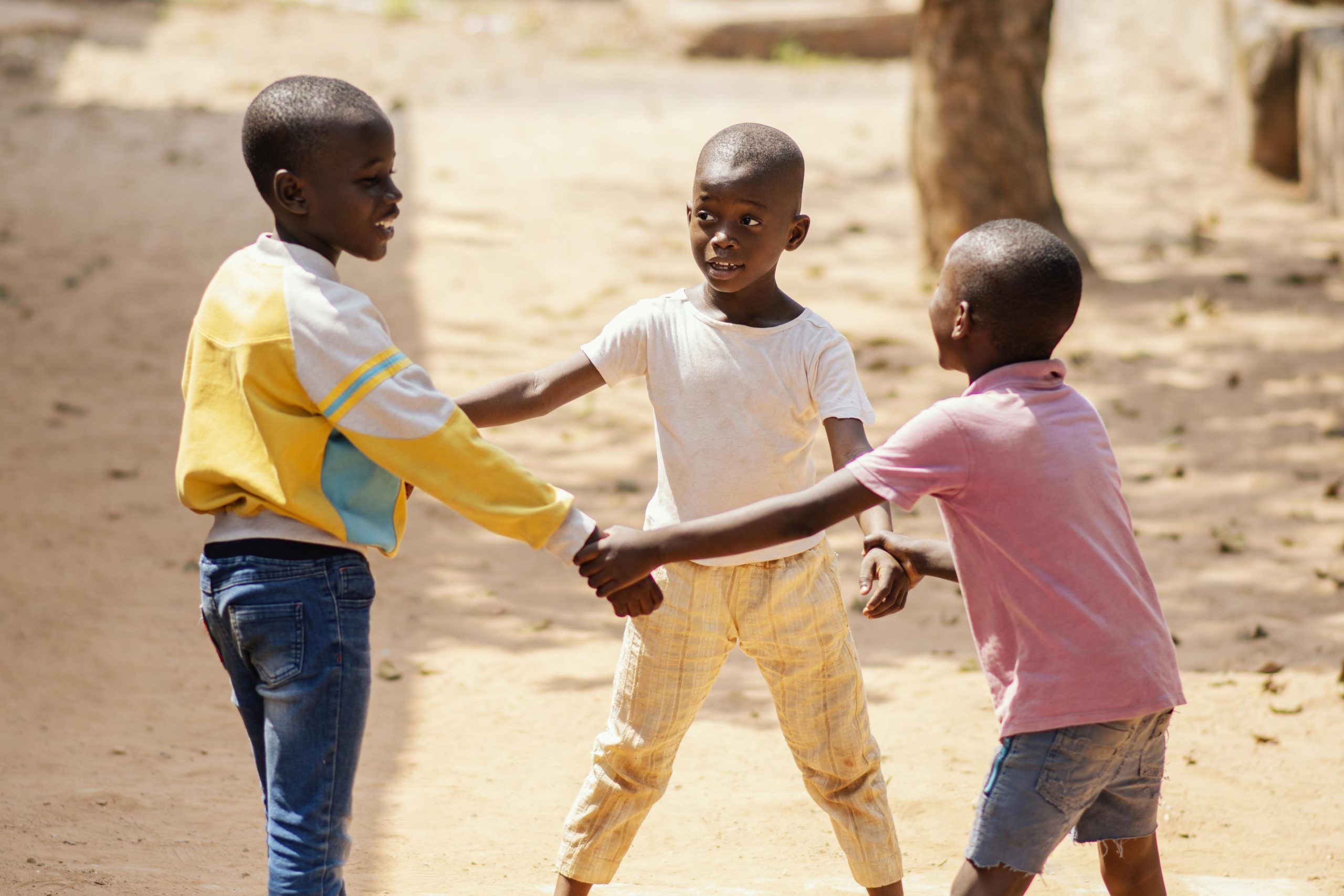 medium-shot-african-boys-playing-together